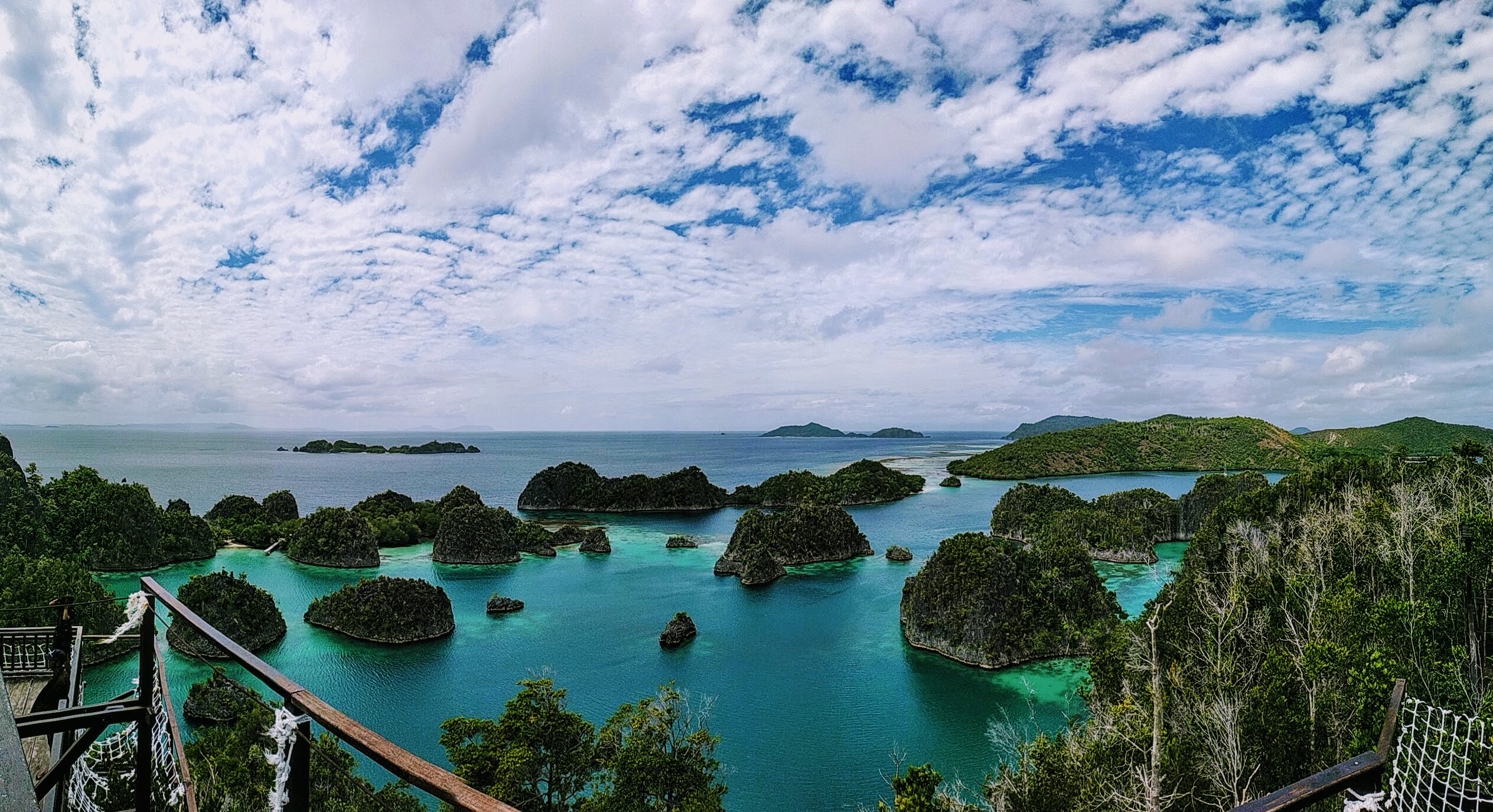 Forested limestone islands and turquoise water at Piaynemo in Raja Ampat